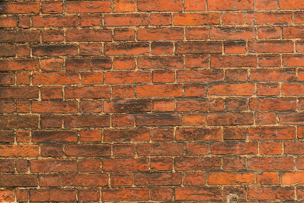 Allstate Media Blasting sandblasting on brick wall